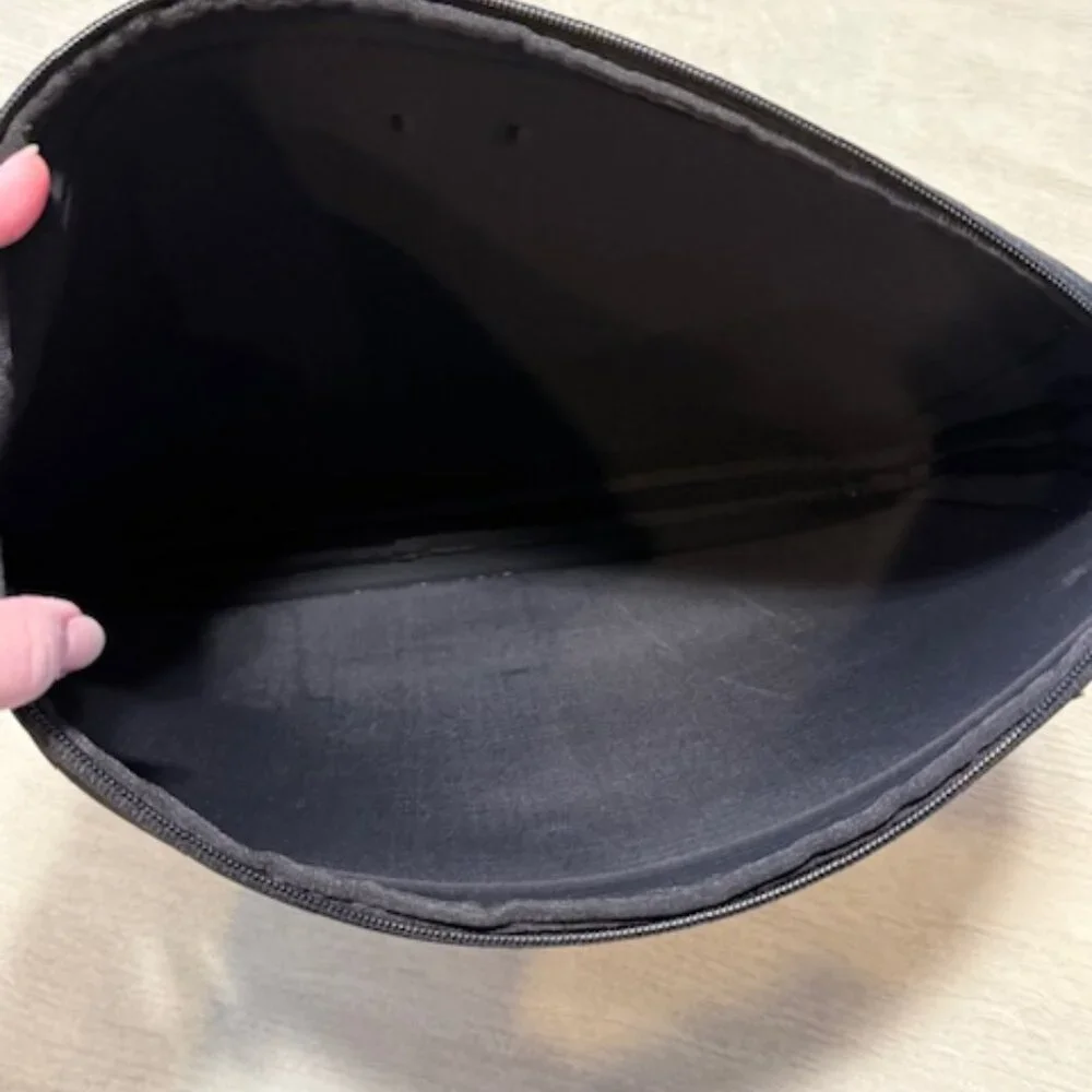 Tumi laptop sleeve.